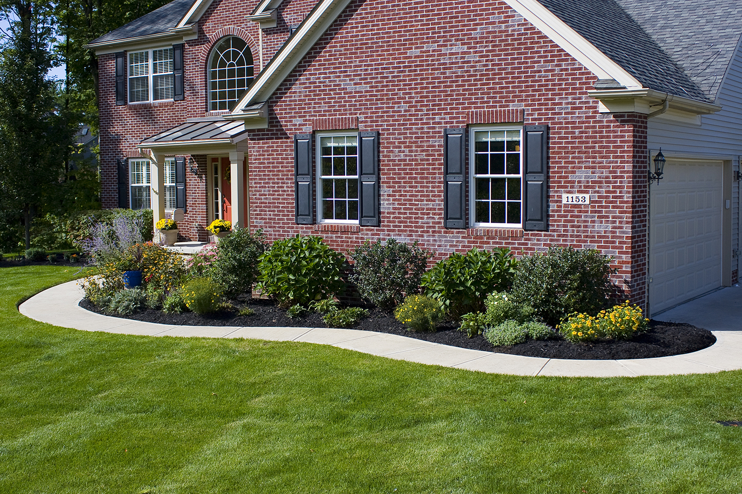 premium black mulch colorant in front of house